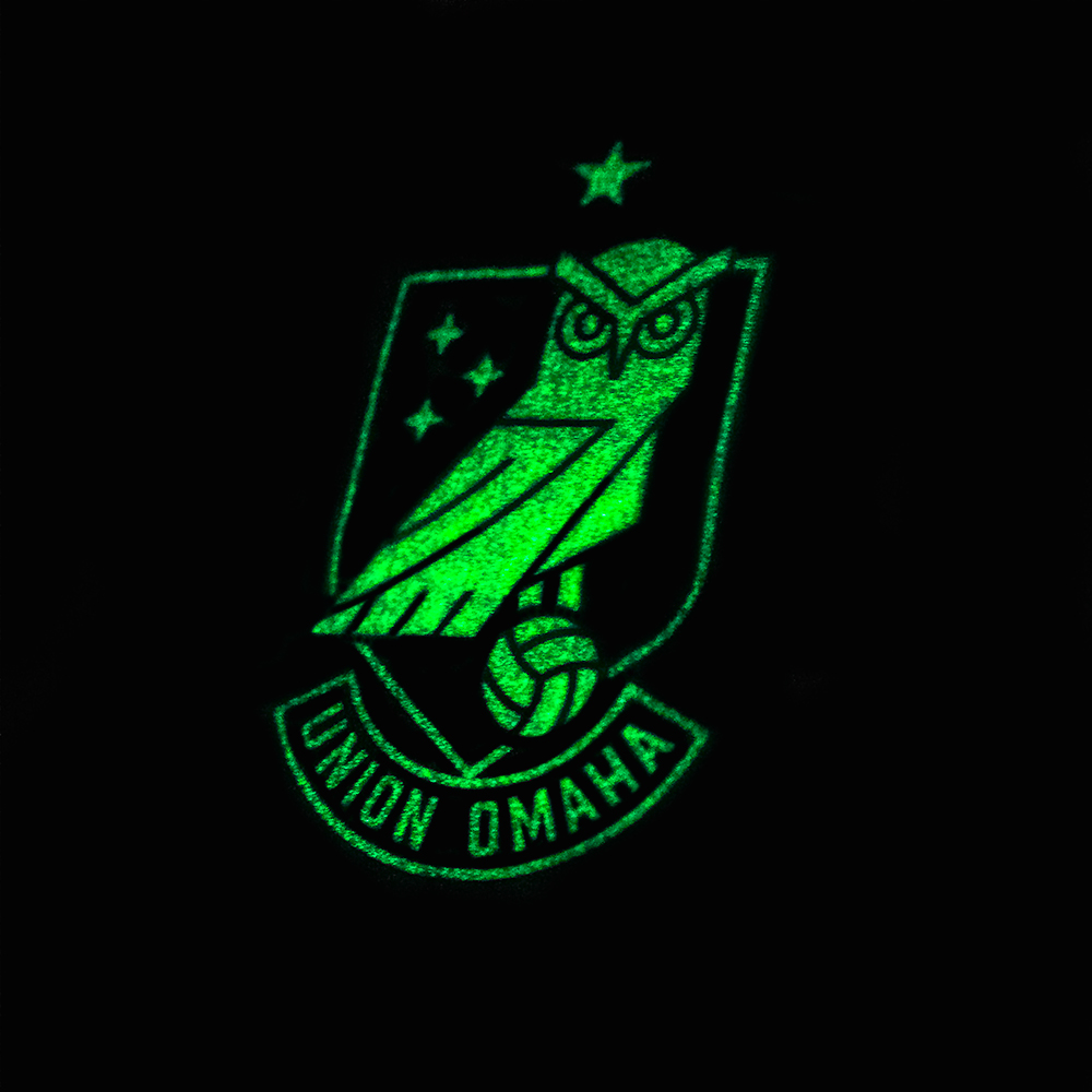 Union Omaha's glow-in-the-dark crest on its 2024 Hummel primary jersey.