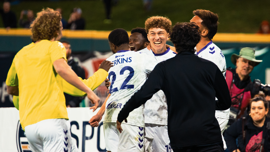 Union Omaha players celebrating after penalty kick win