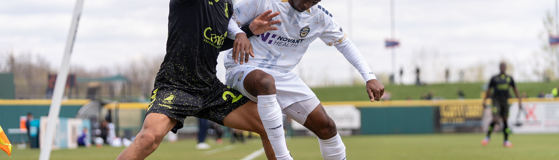 Aaron Gomez fighting for ball against Charlotte Independence