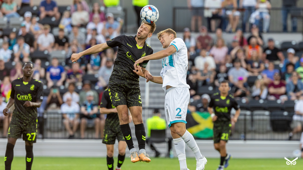 Marco Milanese going up for a header