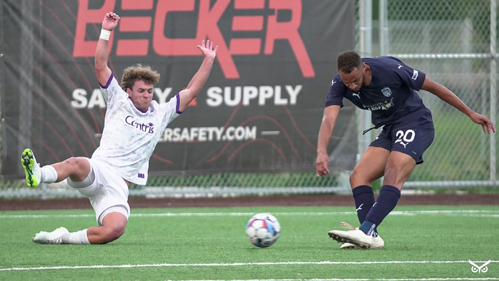 Blake Malone sliding to defend against Northern Colorado