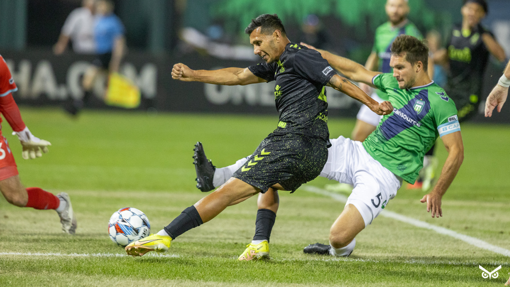 Aaron Gomez striking the ball against Greenville