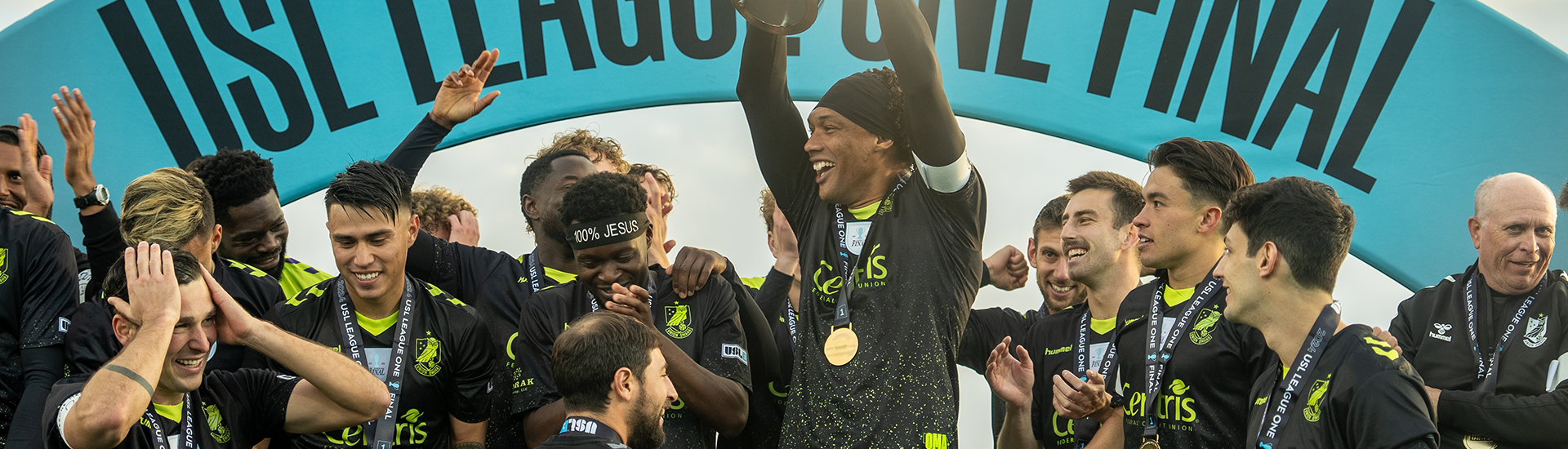 Steevan Dos Santos and team lifting the 2024 USL League One Final trophy