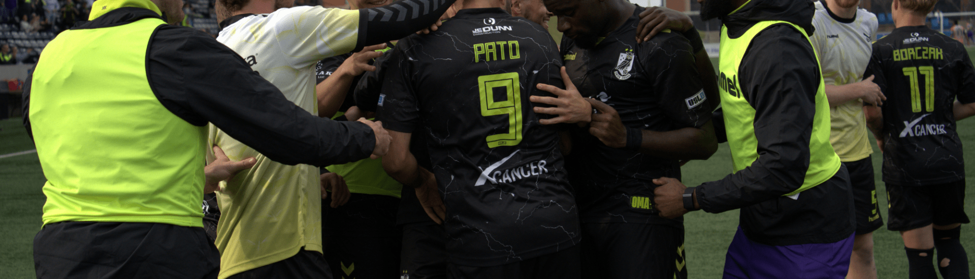 Union Omaha players celebrate with Pato Botello Faz after his game-winning goal against Madison.
