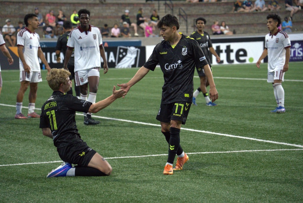 Allen Gavilanes extending a hand to Dylan Borczak in Union Omaha's 2-0 win over Chattanooga Red Wolves.