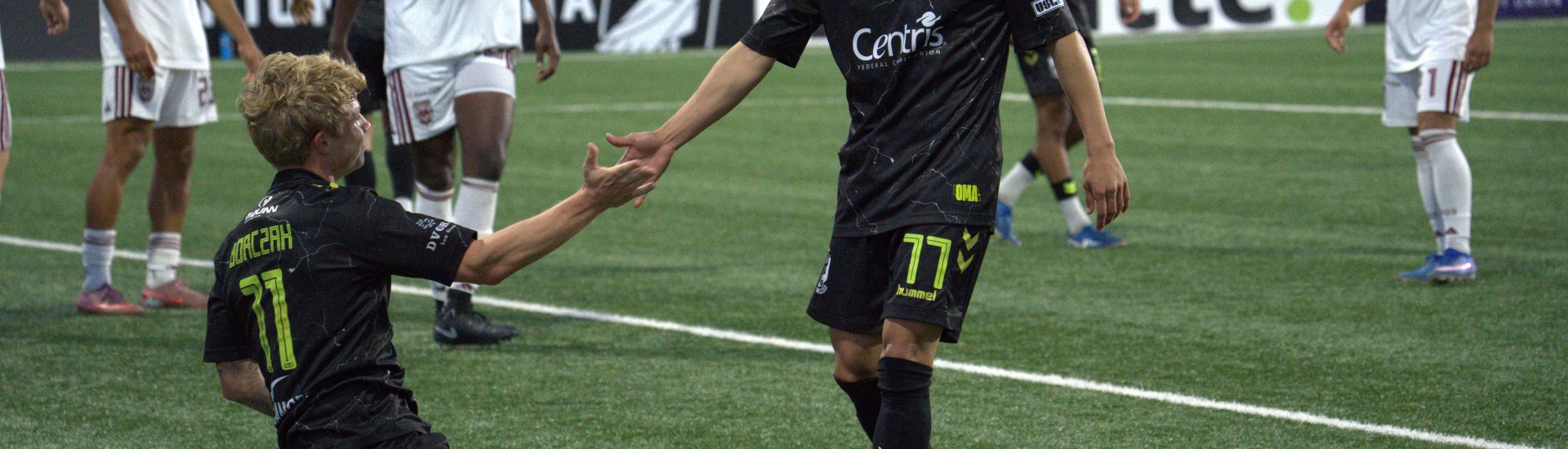 Allen Gavilanes extending a hand to Dylan Borczak in Union Omaha's 2-0 win over Chattanooga Red Wolves.